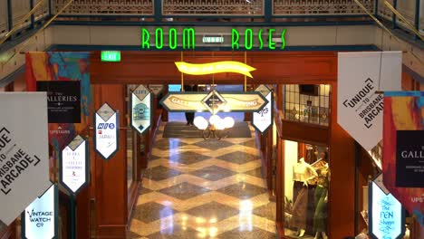 Dynamic-zoom-out-shot-capturing-Room-with-Roses-restaurant-dining-at-heritage-listed-Brisbane-Arcade,-fashion-boutiques,-high-end-jewellery-stores-at-downtown-Queen-street-mall,-Brisbane-city