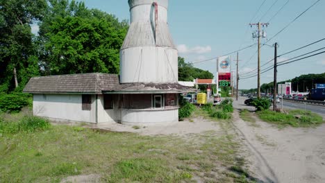 Sliding-shot-towards-the-milk-can-bottle-building-in-Manville