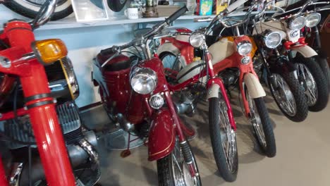 Milzkalne,-Latvia---June-11,-2023:-Vintage-Classic-American-Car-and-Extensive-Collection-of-Jawa-Motorcycle,-Soviet-Moto-Equipment-Garage-Exhibited-in-the-Automobile-Motor-Museum-Located-in-Milzkalne