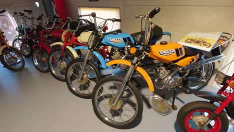 Milzkalne,-Latvia---June-11,-2023:-Vintage-Classic-American-Car-and-Extensive-Collection-of-Jawa-Motorcycle,-Soviet-Moto-Equipment-Garage-Exhibited-in-the-Automobile-Motor-Museum-Located-in-Milzkalne