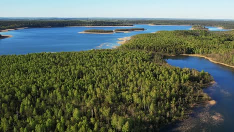 Large-Masurian-lakes-surrounded-by-dense-forests,-aerial-view