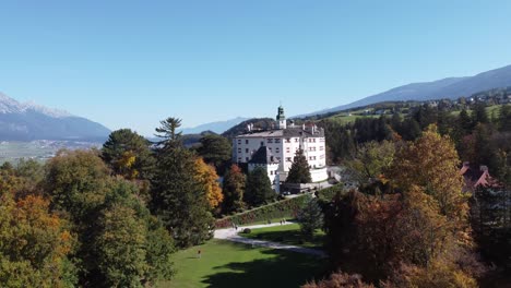 Ambras-Castle-in-an-aerial-view-from-its-outdoor-garden-in-the-middle-of-the-alpine-forests-of-the-city-of-Innsbruck-in-the-Tyrol-region-of-Austria
