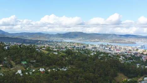4K-Aerial-Drone-FLyover-Hobart-City-Skyline-And-Buildings-With-River-View-Location,-Slow-Motion,-Tasmania-Australia