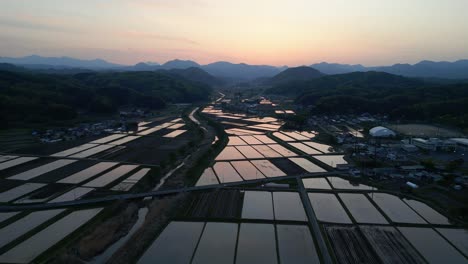 Cinematic-aerial:-Rice-paddy-fields-with-watered-agriculture-in-rural-japan
