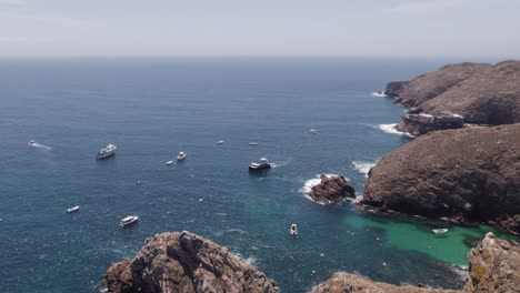 Panoramic-aerial-view-of-inviting-berlengas-islands,-yachts-anchored-near-coast
