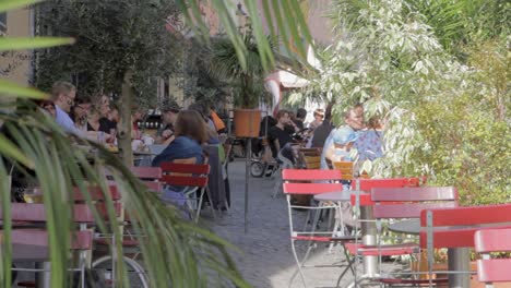 Tourist-sitting-outdoors-in-a-restaurant-in-Marburg,-Germany,-summer-feeling