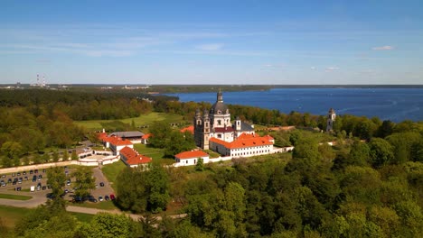 Aerial-shot-of-old-Pazaislis-Monastery-and-Church-on-sunny-day-with-blue-clear-sky,-in-Kaunas,-Lithuania,-zoom-in-shot