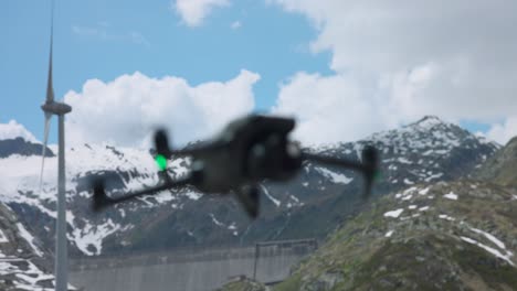 DJI-Mavic-3-Pro-Drone-flying-in-air-with-snow-capped-mountain-scenery-in-Switzerland