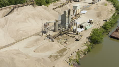 Aerial-View-Of-Sand-And-Gravel-Pit-Plant-Along-The-Arkansas-River-In-Van-Buren,-Arkansas,-USA