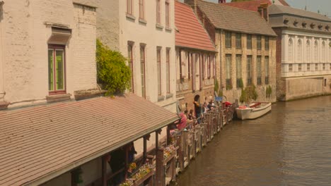 Boat-And-Canal-At-The-Well-Preserved-Medieval-Town-Of-Bruges-In-Belgium-During-Sunny-Day