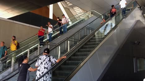Passengers-riding-escalator-inside-metro-train-station-in-Guadalajara,-Mexico