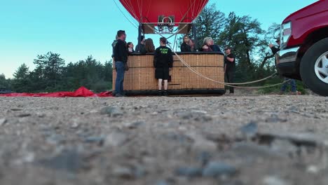 Flight-Crew-Taking-Photo-Of-People-Inside-Hot-Air-Balloon-Gondola-Before-Flying-In-Sedona,-Arizona