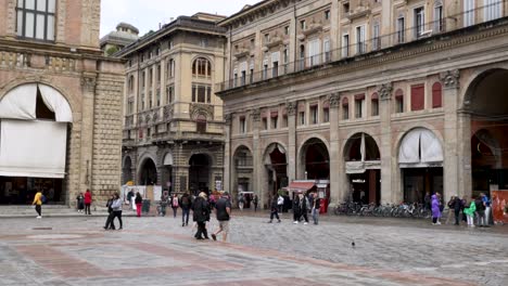 People-Walking-Across-Piazza-Maggiore-In-Bologna