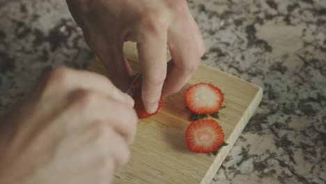 Fresh-Organic-Strawberry-Cut-Over-Wooden-Board