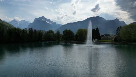 Majestic-water-display-of-large-magnificent-ornamental-fountain-on-Walensee-lake