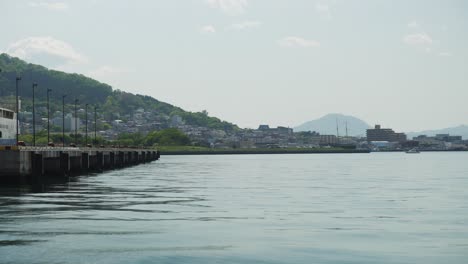 Pier-and-Hakodate-Bay-alone-on-a-sunny-day,-Hokkaidō-Japan