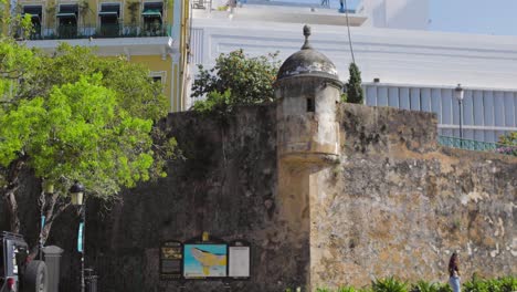 A-historical-wall-of-Felipe-El-Morro-fortress-still-standing-in-the-midst-of-the-financial-district-area-of-Old-San-Juan,-Puerto-Rico