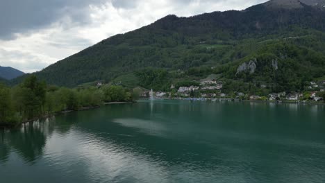 Walensee-lake-shore-Swiss-Alpine-scenery-at-Weesen,aerial-view-Switzerland