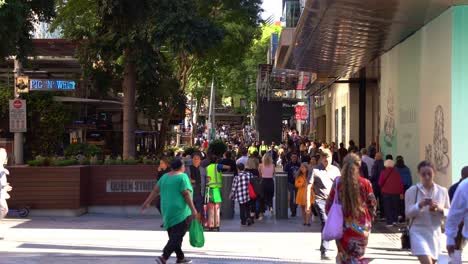 Bustling-downtown-Brisbane,-large-crowds-of-people-strolling-and-shopping-at-iconic-Queen-street-mall-on-a-sunny-day,-Queensland,-the-sunshine-state-of-Australia,-static-shot