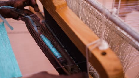 close-up-scene-of-weaving-and-sewing-with-plastic-silk-threads-is-being-done-by-Kutch-women-as-handicrafts