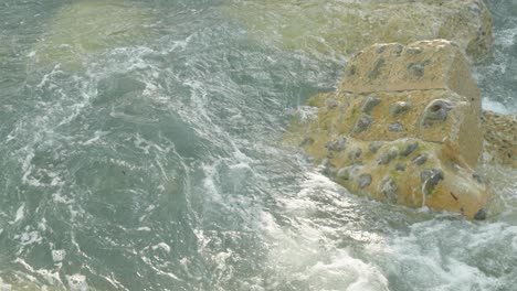 4k,-slow-motion-shot-of-waves-hitting-a-coastal-rock-in-the-British-seaside