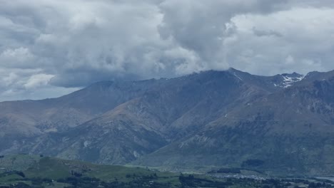Timelapse-of-mountain-range-and-storm-clouds-forming-on-top-as-viewed-from
