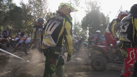 ATV-Driver-Going-Down-Over-Small-Mount-To-Join-His-Group-Of-Riders