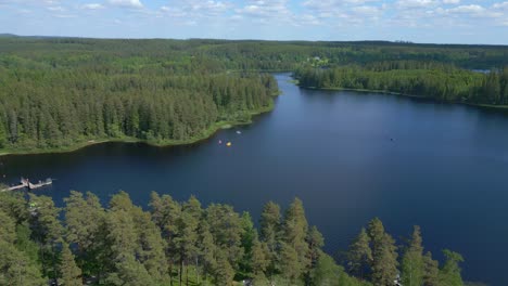 Aerial-Shot-of-Forest-and-Lake-at-Isaberg-Mountain-Resort-in-Sweden