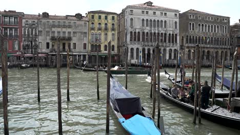 Slow-motion-footage-of-Gondolas-moored-in-the-Grand-Canal-Venice,-Italy