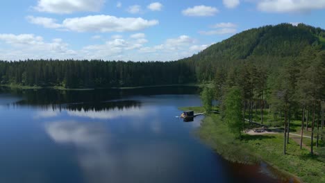 Breathtaking-Aerial-Shot-of-Forest-and-Lake-at-Isaberg-Mountain-Resort-in-Sweden