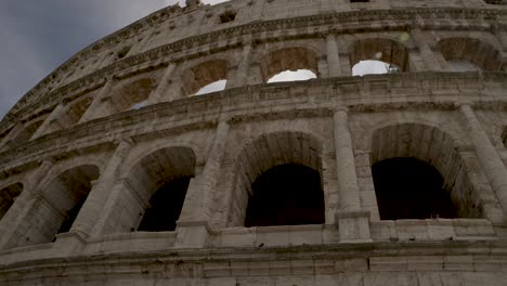 Looking-Up-At-The-Colosseum-In-Rome-With-Slow-Motion-Pan-Right