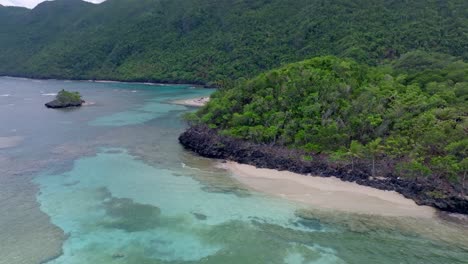 Aerial-panorama-of-beautiful-coastline-with-green-mountains-and-turquoise-shoreline-in-summer