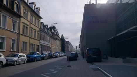 Cars-near-hotel-in-bavarian-downtown-near-road-in-Karlsruhe-Germany