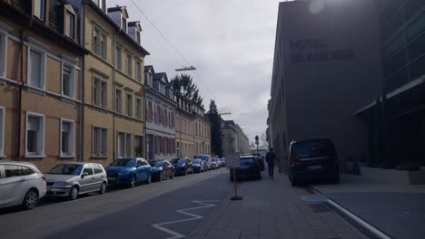 People-walking-near-cars-in-bavarian-downtown-near-road-in-Karlsruhe-Germany