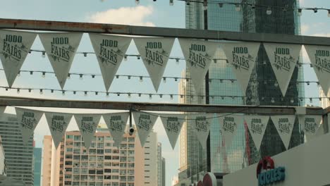 Jodd-Fairs-Outdoor-Market-Triangular-Flags-in-Bangkok,-Thailand