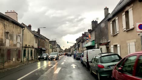 Camera-pans-forward-with-raindrops-falling-on-the-car-window