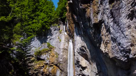 Aerial-Reverse-Shot-of-Berglistüber-Waterfall-in-Switzerland