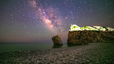 Aphrodite's-Rock-seen-from-the-Kouklia,-Cyprus-beach---Milky-Way-time-lapse-background