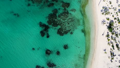Aerial-drone-landscape-shot-of-holiday-beach-spot-white-sand-clear-ocean-water-rocky-reef-Saint-Lawrence-Beach-Siviri-travel-tourism-South-Pacific-Vanuatu-4K