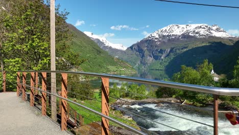 Tourist-walkway-close-to-river-in-Geiranger-Norway---Tourists-point-of-view-showing-fjord-and-river---Handheld-stabilized-pov-clip