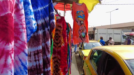 African-tye-dye-clothing-and-designs-on-display-in-Gambian-market