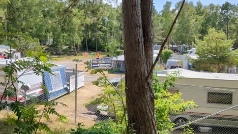 4K-60FPS-Idyllic-Trailer-Park-in-Swedish-Forest,-Family-Time,-Vacation-in-Sweden---Panoramic-Shot