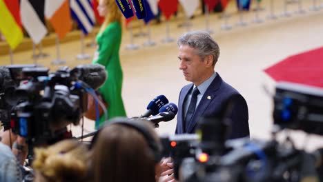 x-Prime-Minister-of-Slovenia-Robert-Golob-giving-an-interview-during-the-European-Council-summit-in-Brussels,-Belgium---Slow-motion-shot