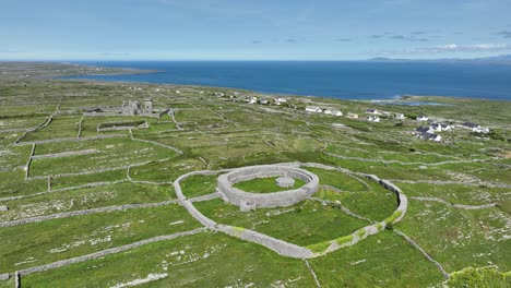 Drone-circling-prehistoric-fort-on-inis-Mor-Aran-Islands-West-Of-Ireland-with-stunning-vistas-of-the-island-and-Atlantic-Sea