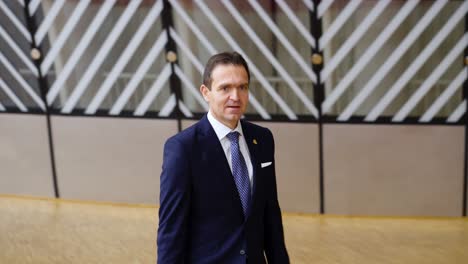 Prime-Minister-of-Slovakia-Ľudovít-Ódor-arriving-at-the-European-Council-summit-in-Brussels,-Belgium---Slow-motion