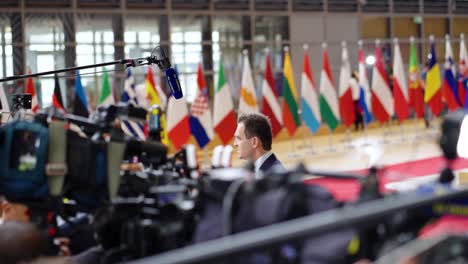 Prime-Minister-of-Slovakia-Ľudovít-Ódor-giving-an-interview-during-the-European-Council-summit-in-Brussels,-Belgium---Wide-angle-shot