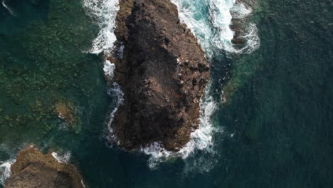 Roque-Partido,-Gran-Canaria:-Fantastic-aerial-shot-from-above-of-the-rock-formation-Roque-Partido-on-the-island-of-Gran-Canaria-and-on-a-sunny-day