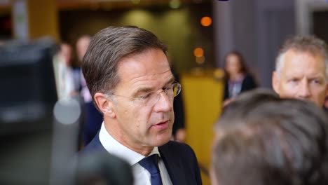 Prime-Minister-of-the-Netherlands-Mark-Rutte-giving-an-interview-during-the-European-Council-summit-in-Brussels,-Belgium---Close-shot