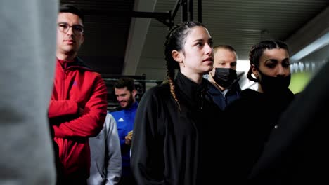 Young-and-fit-women-standing-in-a-group-of-people-ready-to-start-the-crossfit-run-in-Montpellier