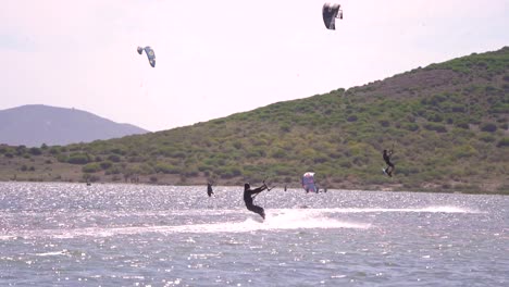 Los-Alcazares,-Spain,-May-3,-2023:-Sportsman-practicing-kite-surf-sport-at-the-beach-on-a-windy-day-at-the-Spanish-coasts